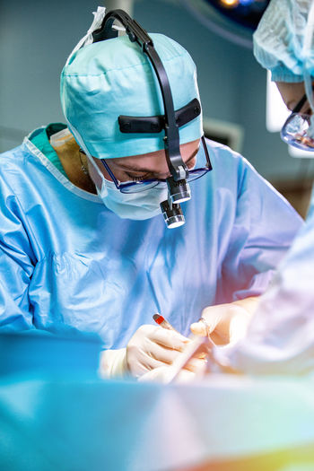 Surgeons performing surgery at hospital