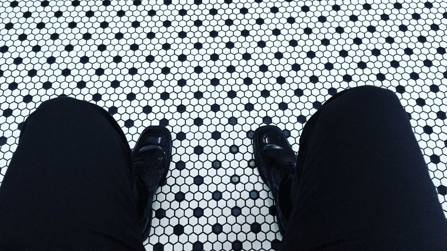 Low section of man on patterned floor