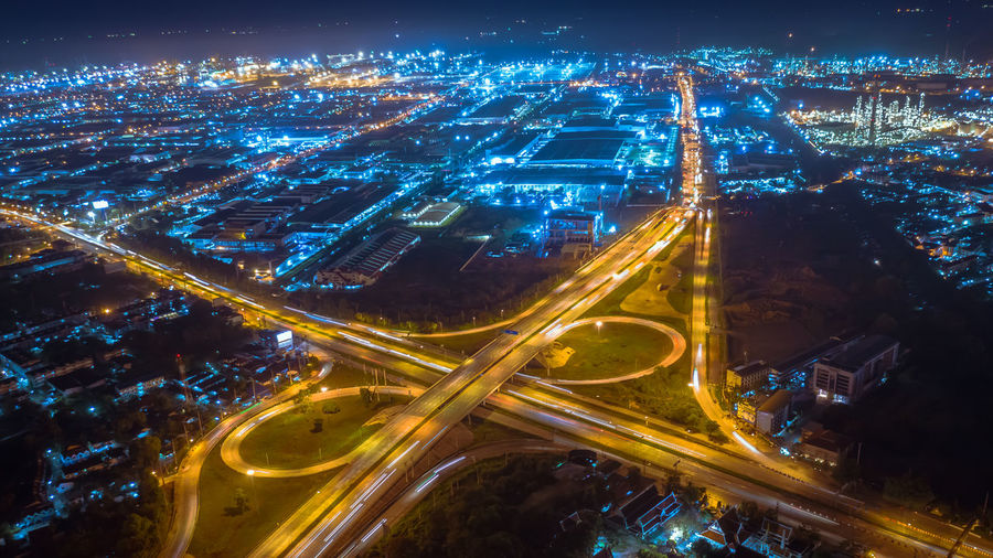 Twilight landscape ring road inter city and lightning cityscape background at night aerial view 