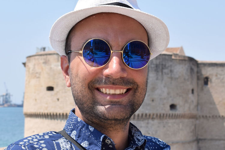 Portrait of smiling mid adult man wearing sunglasses