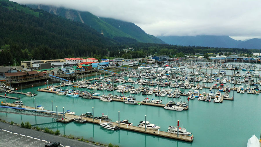 High angle view of harbor by sea against sky