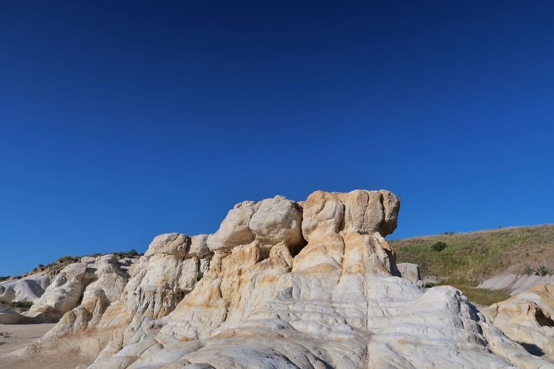 Landscape of white and yellow rock formations in colorado - paint mines interpretive park