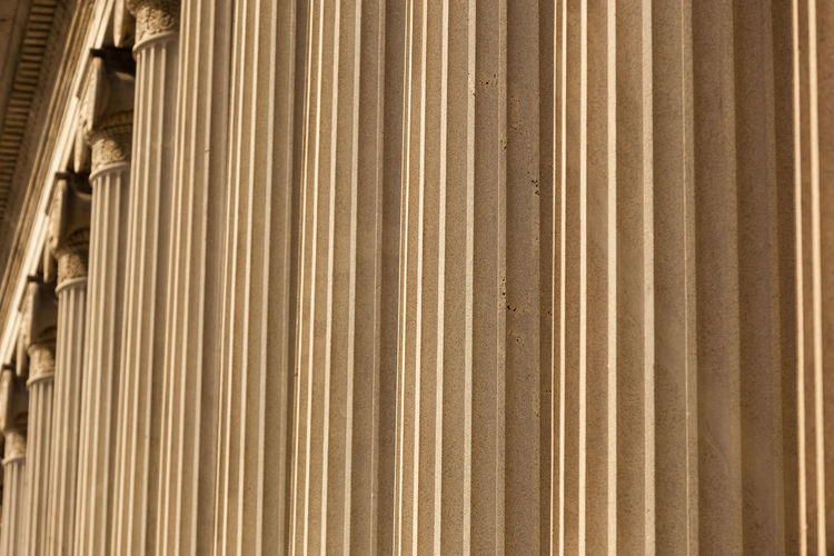 Row of columns of the treasury department building in washington, dc - abstract closeup, background