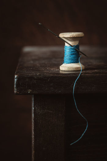 Close-up of spool and thread on table