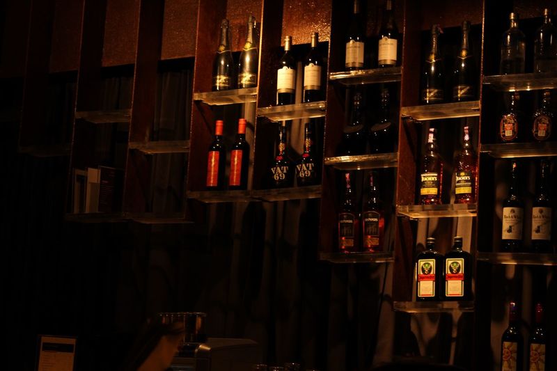 Row of wine bottles on shelf