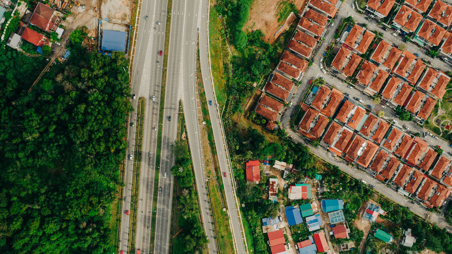 Aerial view of highway by residential buildings
