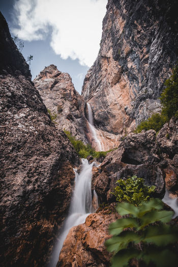 Waterfall in the mountains in spring with refreshing splashes