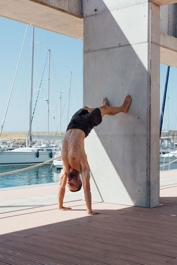 Sportsman practicing stretching and calisthenics