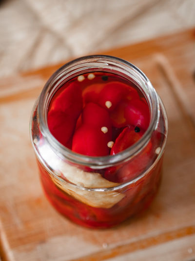 Close up of pickled peppers in jar