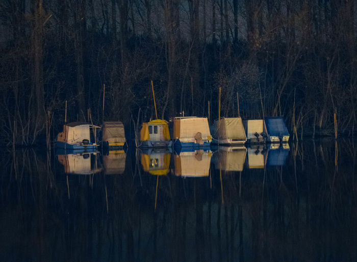 Boats on lake at night