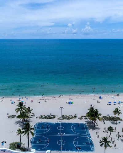 High angle view of basketball court and beach against sky