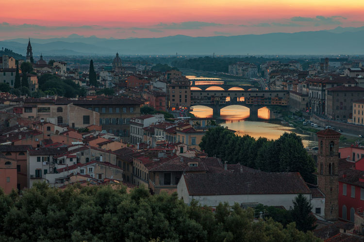 Panorama of the city at sunset, view from piazzale michelangelo to river arno with numerous bridges