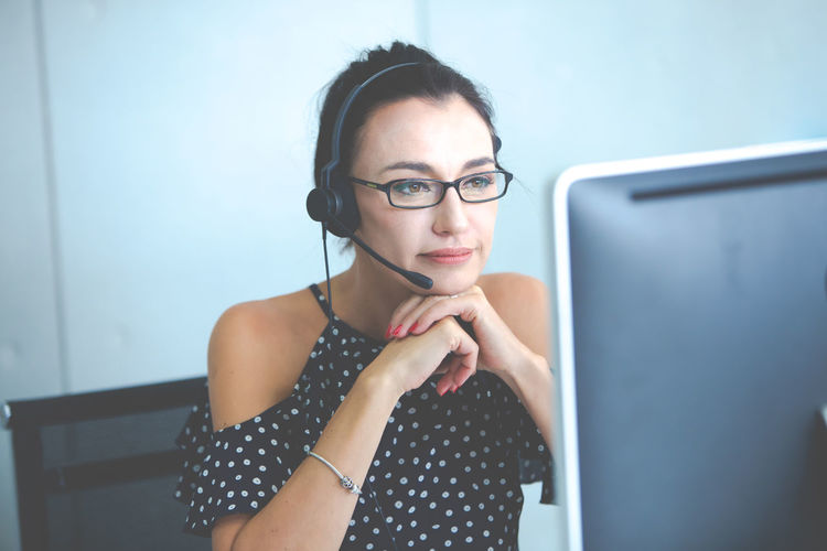 Close-up of woman wearing eyeglasses working in office