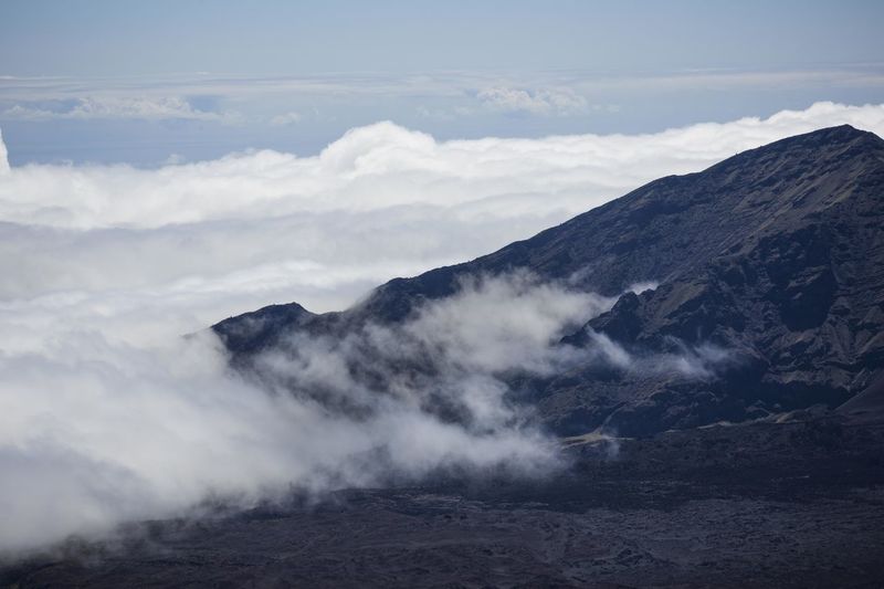 Scenic view of mountains against sky clouds volcano crater