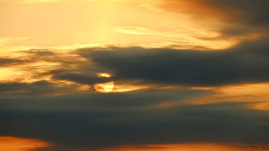 Low angle view of dramatic sky during sunset