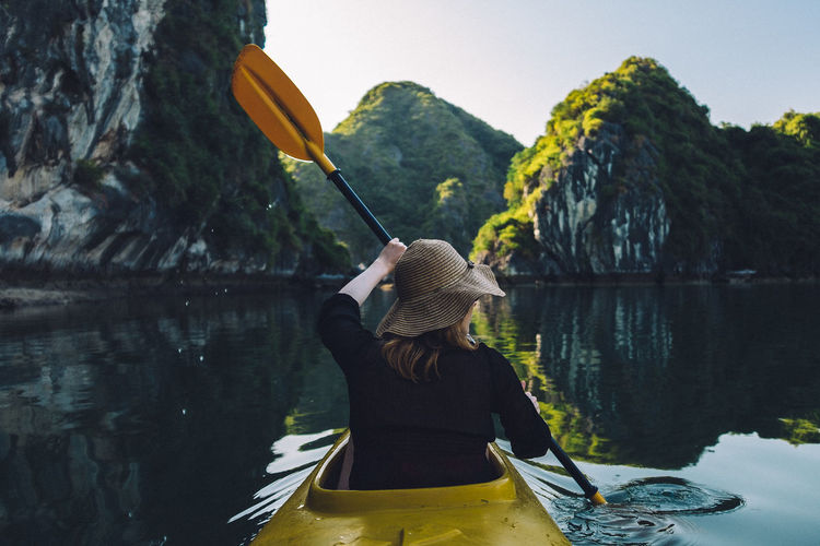 Rear view of woman looking at lake