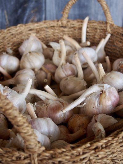 Close-up of garlics in basket