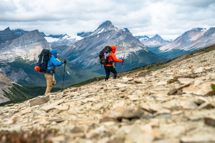 Couple hiking over an unnamed pass in banff national park