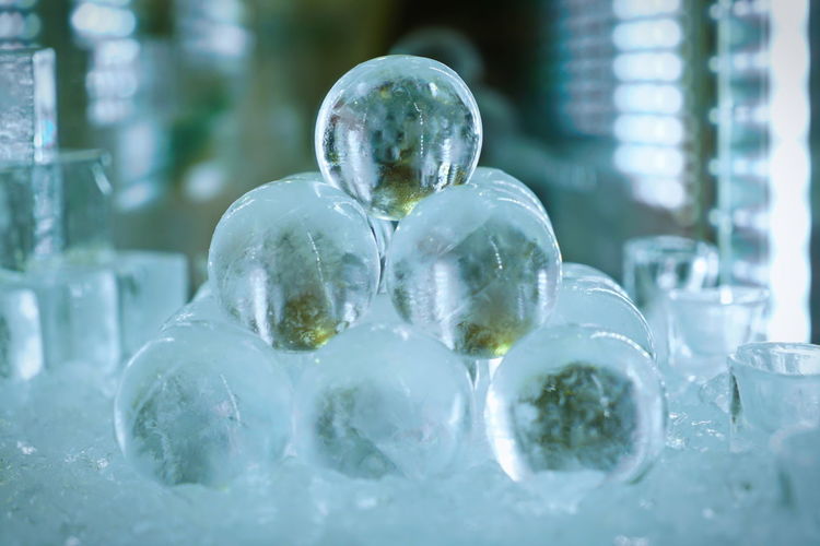 Ice balls and cubes, on a green background