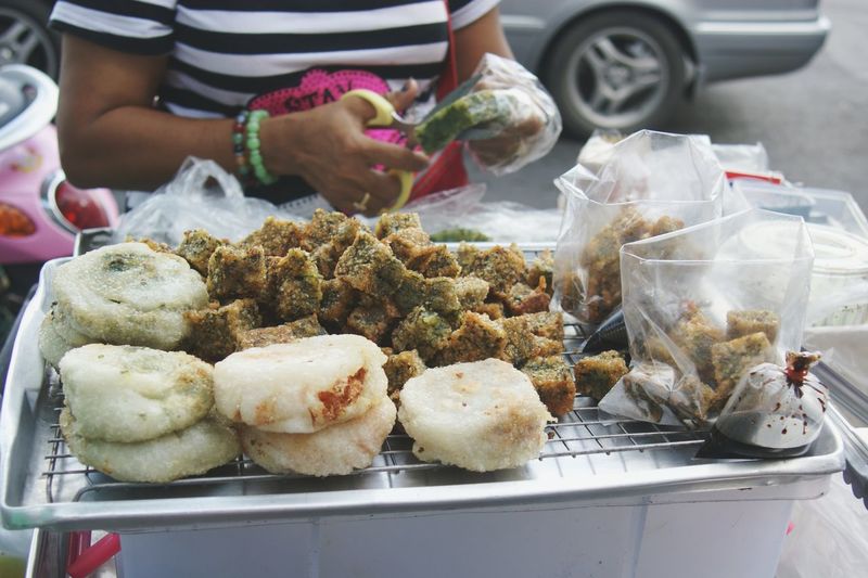 Midsection of woman selling food at market