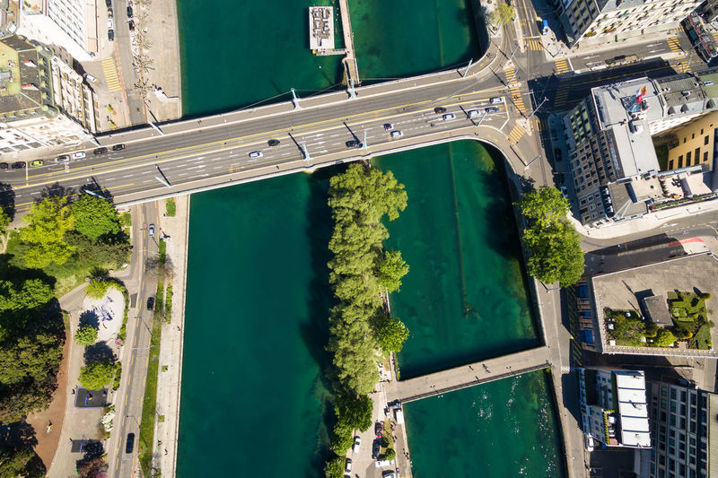 High angle view of swimming pool by building in city