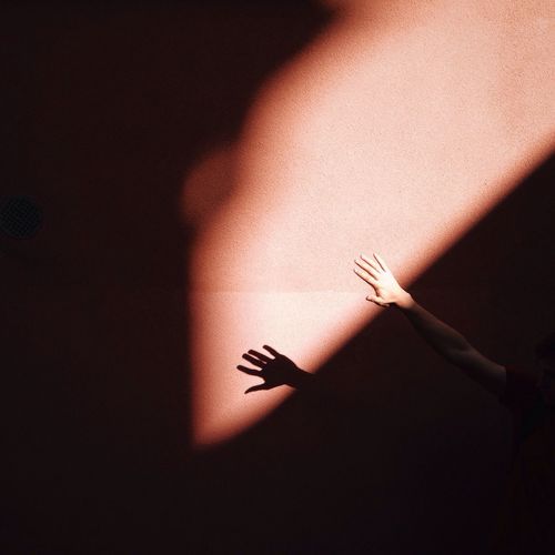 Close-up of human arm and shadow
