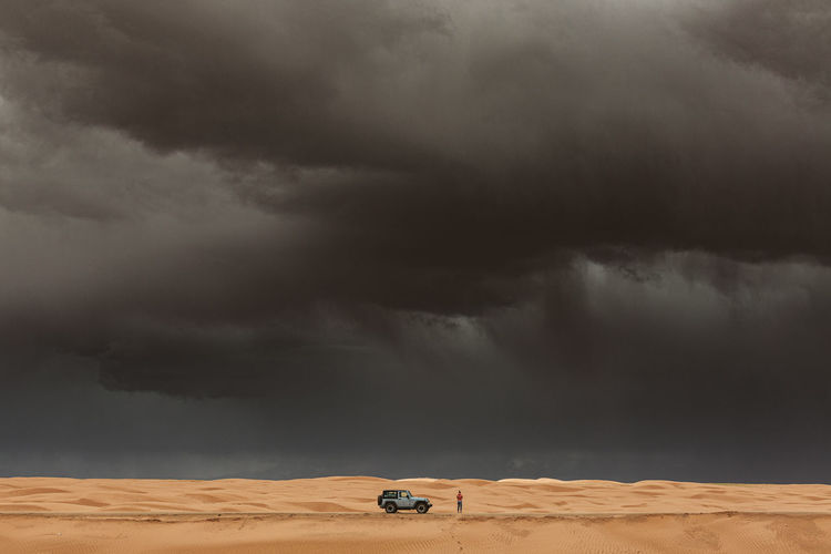 Woman gets out of jeep to take pictures of microburst in utah desert