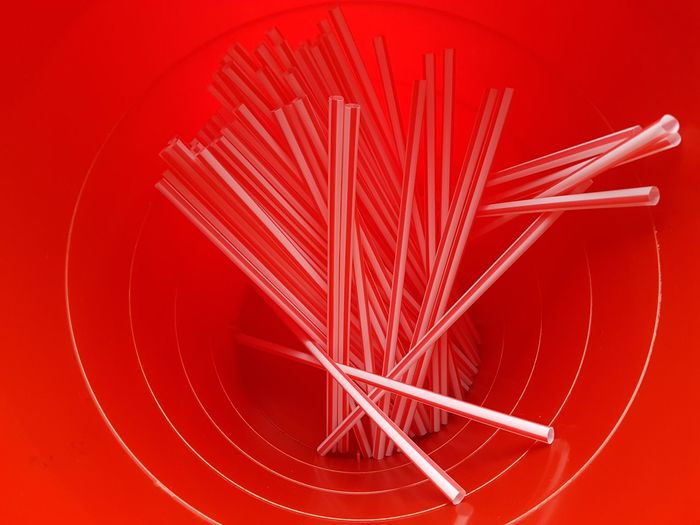 Full frame shot of straws in red trashcan 