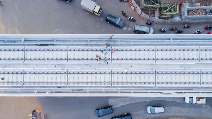Directly above shot of railway bridge over road in city