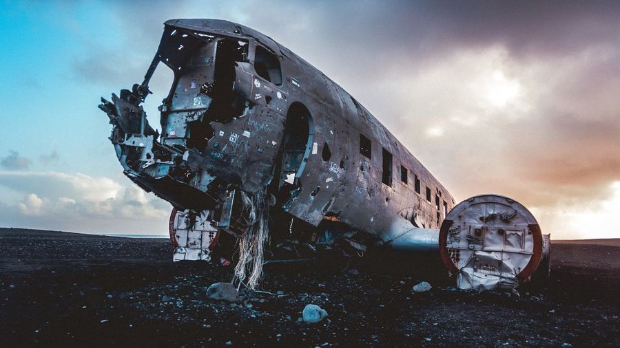 Abandoned airplane wreck on volcanic beach in iceland
