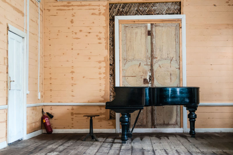 Piano on hardwood floor at home