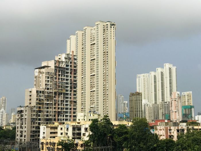 Modern buildings in city against sky