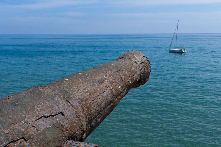 Sailboat on sea against sky