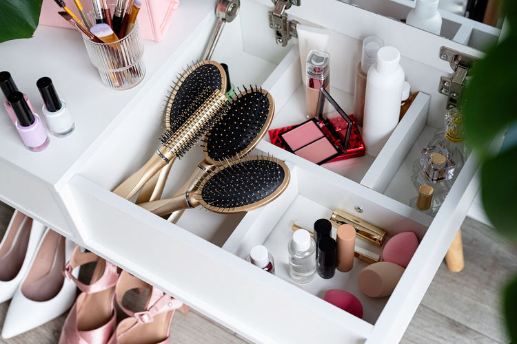 Closeup of elegant high heel shoes standing under feminine dressing table