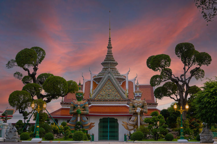View of temple building against sky during sunset