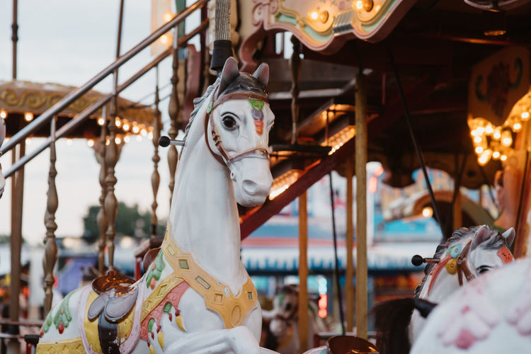 Close-up of carousel during sunset