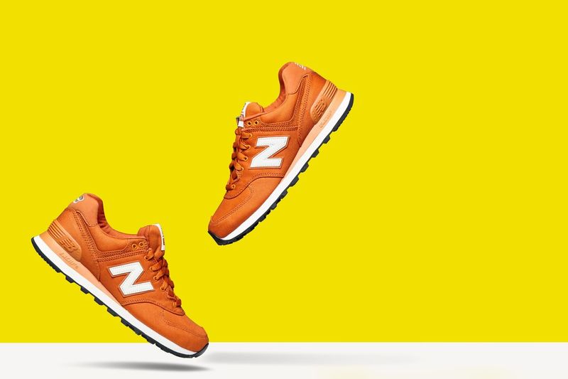 Low section of shoes over white background