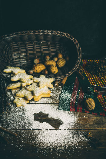 High angle view of cookies and walnuts on table