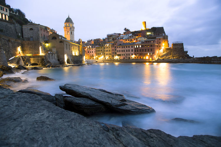 Cinque terre town and harbor seascape after sunset, vernazza, la spezia