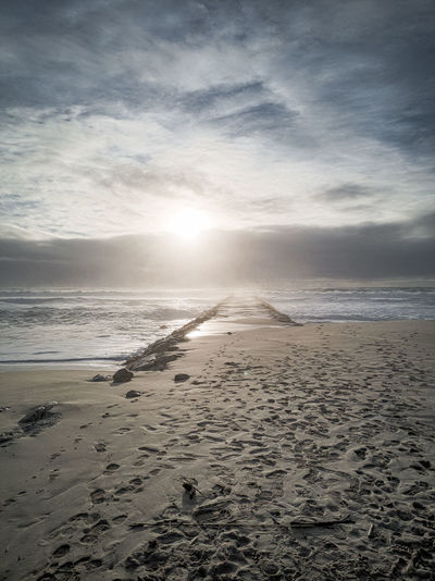 Scenic view of beach against sky