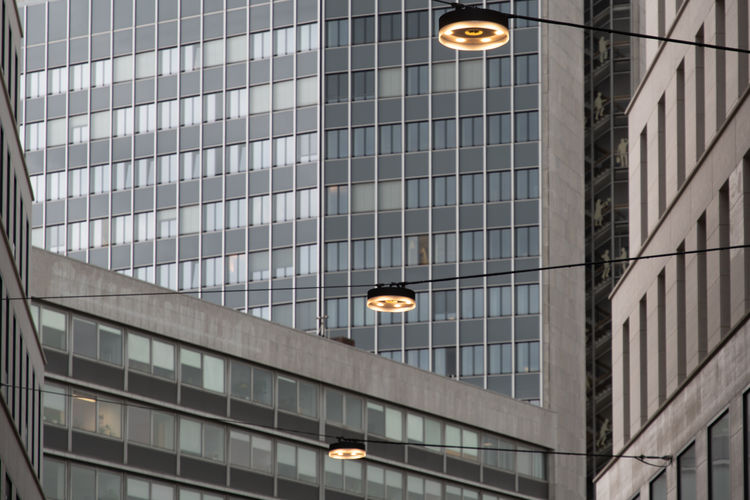 Low angle view of illuminated pendant light in building