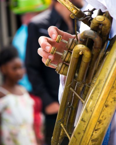 Cropped hand playing trumpet