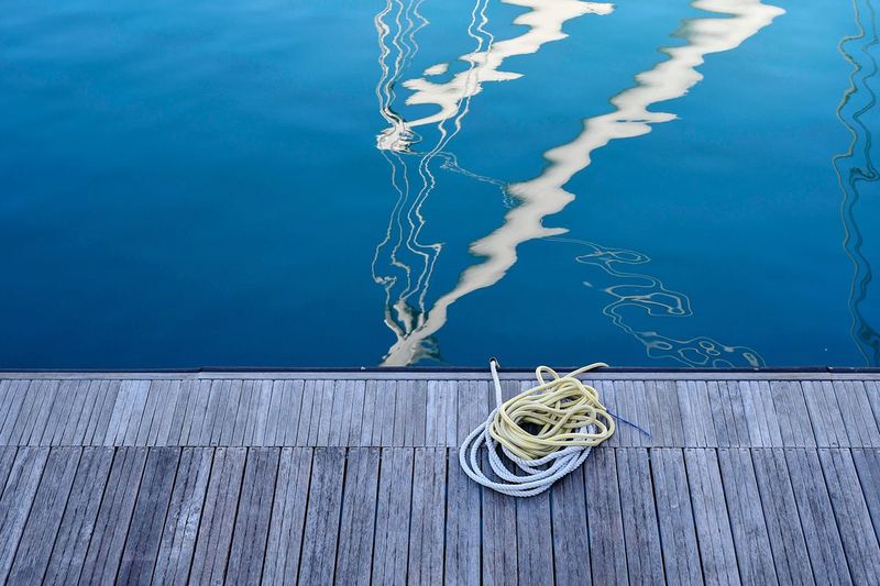 Nautical ropes on a wooden dock of the port