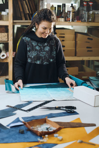 Portrait of young woman working at office