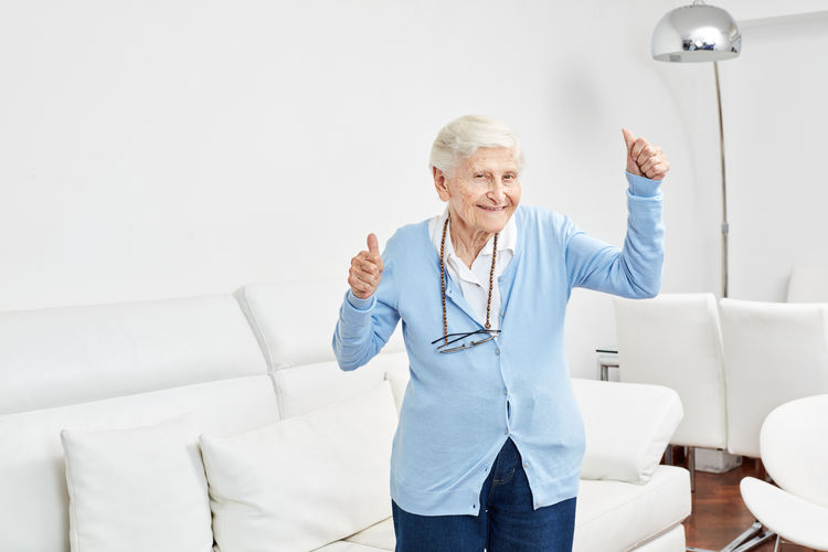 Smiling senior woman dancing at nursing home