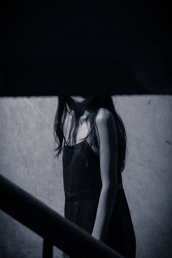 Woman standing on staircase