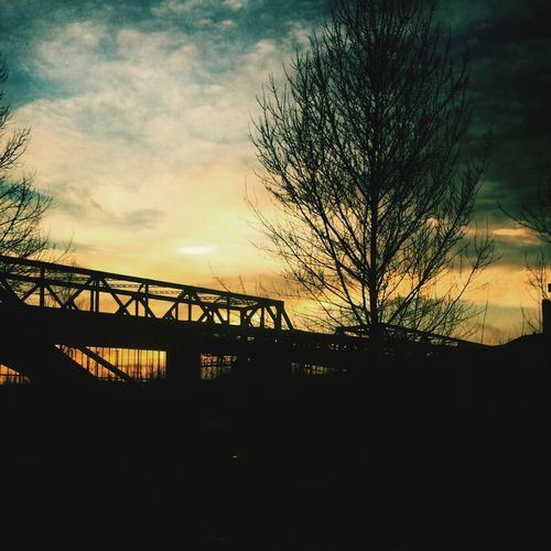 Silhouette of bridge at sunset