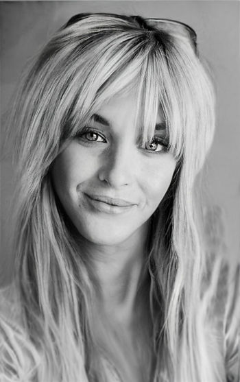 Blonde and content woman smiling. monochrome closeup photo.