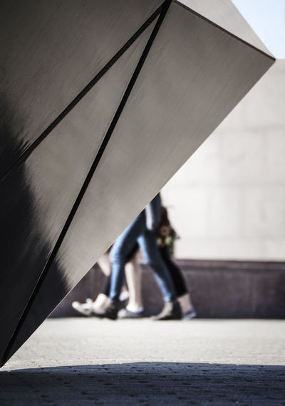 Low section of people walking on footpath