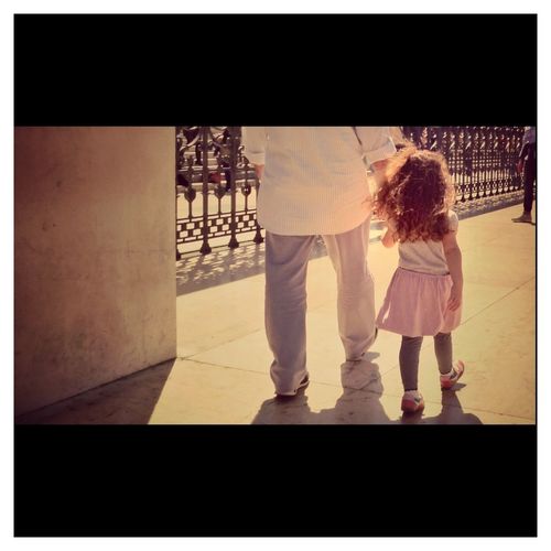 Full length of woman standing by railing